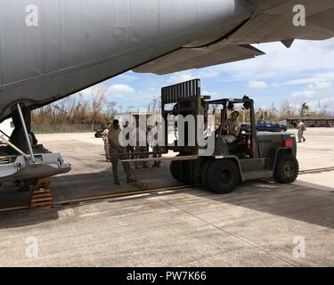 Tech. Sgt. Efrain Rodriguez, 156th Airlift Wing, unloads a pallet of supplies at Muniz Air National Guard Base, Puerto Rico, Sept. 24, 2017. The Puerto Rico Air National Guard is working with numerous local and federal agencies in response to Hurricane Maria. Stock Photo