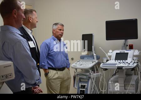 From left to right, Col. Kirk Gibbs, U.S. Army Corps of Engineers Los Angeles District commander; Maj. Gen. Thomas Tempel, commanding general, Regional Health Command-Central; and Lt. Gen. Todd Semonite, commanding general, USACE, listen to a briefing during a Sept. 20 tour of the new Army Weed Community Hospital at Fort Irwin, California Stock Photo