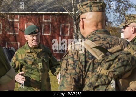 Norwegian Army Maj. Gen. Odin Johannessen, chief of staff, left, speaks with Commandant of the Marine Corps Gen. Robert B. Neller, Setermoen, Norway, Sept. 28, 2017. Neller visited Setermoen to strengthen the military-to-military relationship between the two countries. Stock Photo