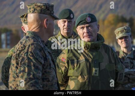 Norwegian Army Maj. Gen. Odin Johannessen, chief of staff, right, speaks with Commandant of the Marine Corps Gen. Robert B. Neller, Setermoen, Norway, Sept. 28, 2017. Neller visited Setermoen to strengthen the military-to-military relationship between the two countries. Stock Photo