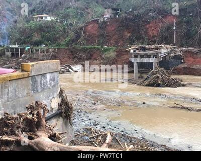 UTUADO, Puerto Rico, Sept. 26, 2017 - Members of New York Task Force 1 and the Puerto Rico National guard delivered food and water to residents near Utuado, Puerto Rico, Sept. 26. Stock Photo