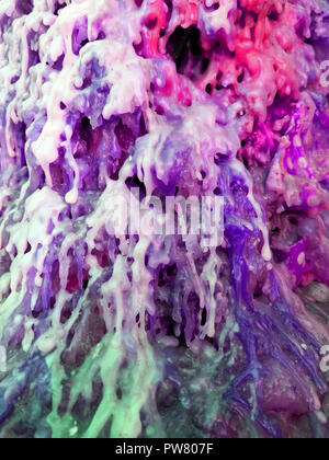 Multicolored mixed wax from a burnt candles Stock Photo