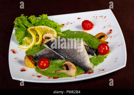 Steamed Dorada fish fillet with sauce Stock Photo - Alamy