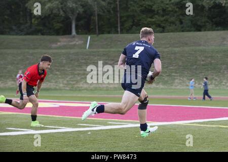A Royal Sailor assigned to the Royal Navy Rugby Team participates in an exhibition game between the All Marine Rugby Team and Royal Navy Rugby Team at Butler Stadium on Marine Corps Base Quantico, Va., Sept. 20, 2017. The match was a part of the Royal Navy Rugby Union Senior XV Tour, which consisted of matches against the United States Naval Academy and the Potomac Rugby Club. Stock Photo