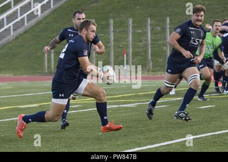 A Royal Sailor assigned to the Royal Navy Rugby Team participates during an exhibition game between the All Marine Rugby Team and Royal Navy Rugby Team at Butler Stadium on Marine Corps Base Quantico, Va., Sept. 20, 2017. The match was a part of the Royal Navy Rugby Union Senior XV Tour, which consisted of matches against the United States Naval Academy and the Potomac Rugby Club. Stock Photo