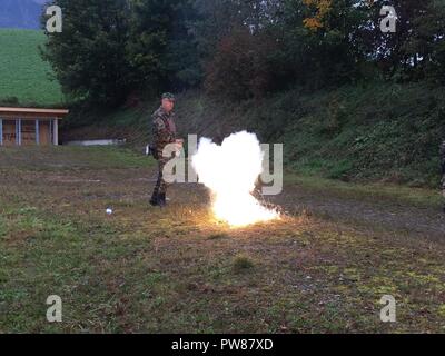 Swiss Army Sergeant Major Schneider provides a pyrotechnics demonstration to military and civilian personnel of Organization for Security Cooperation in Europe member states during the Swiss Army Ammunition Site Assessment Course near Thun, Switzerland on September 27, 2017. Stock Photo