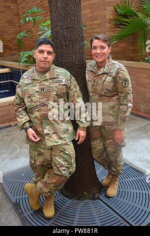 Army Capt. John Arroyo and 1st Lt. Katie Ann Blanchard pose outside of Brooke Army Medical Center on Joint Base San Antonio-Fort Sam Houston. The officers are both workplace violence survivors hoping to share a story of hope with other service members and civilians. Stock Photo