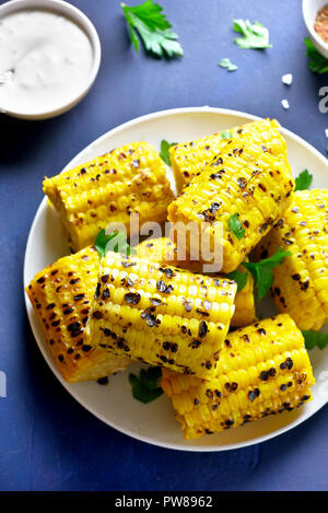 Grilled sweet corn. Vegetarian vegan or natural organic food concept. Tasty snack Stock Photo
