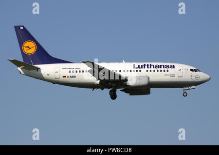 German Lufthansa Boeing 737-500 (old livery) with registration D-ABID on short final for runway 14 of Zurich Airport. Stock Photo