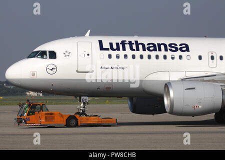 German Lufthansa Airbus A319-100 on pushback at Milan Malpensa Airport. Stock Photo