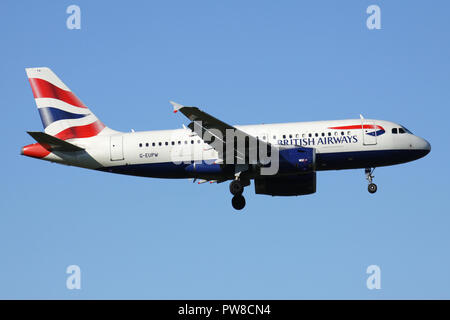 British Airways Airbus A319-100 with registration G-EUPW on short final for runway 14 of Zurich Airport.