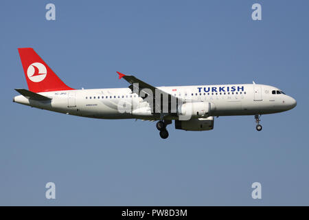 Turkish Airlines Airbus A320-200 with registration TC-JPO on short final for runway 14 of Zurich Airport. Stock Photo