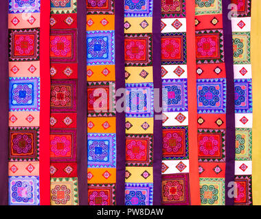 Display of multicolored ethnic curtains with geometric shapes Stock Photo