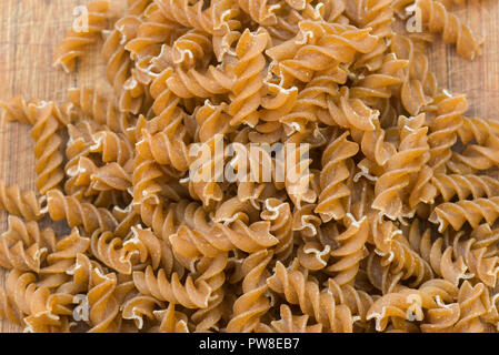 wholemeal raw fusilli pasta closeup Stock Photo