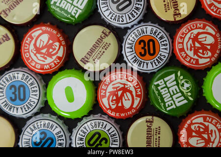 WOODBRIDGE, NEW JERSEY - October 13, 2018: A collection of colorful gluten free and gluten reduced beer bottle caps are seen in this illustrative imag Stock Photo