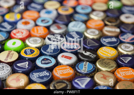 WOODBRIDGE, NEW JERSEY - October 13, 2018: A collection of colorful beer bottle caps of different brands is seen Stock Photo