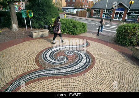 A pebble mosaic (by Maggy Howarth) set in the pavement next to a shopping area in Hook, Hampshire. Stock Photo