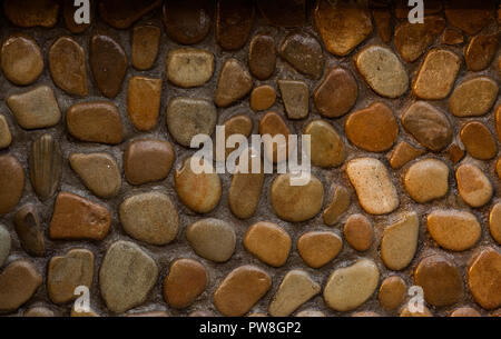 Wall round stone rock texture and seamless background Stock Photo