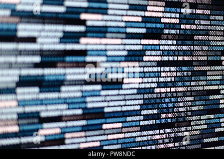 Big overload blockchain data. Blue binary data code background for internet and cyberspace security function. one and zero text on LED moniter screen. Stock Photo