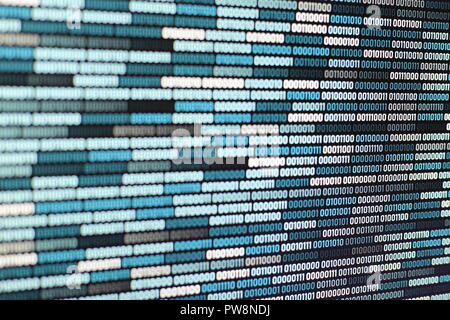Big overload blockchain data. Blue binary data code background for internet and cyberspace security function. one and zero text on LED moniter screen. Stock Photo