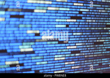 Big overload blockchain data. Blue binary data code background for internet and cyberspace security function. one and zero text on LED moniter screen. Stock Photo