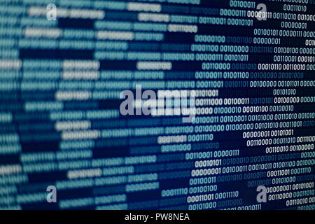 Big overload blockchain data. Blue binary data code background for internet and cyberspace security function. one and zero text on LED moniter screen. Stock Photo