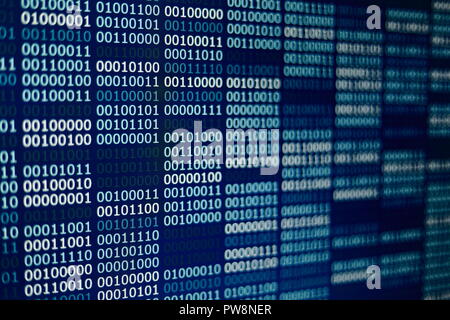 Big overload blockchain data. Blue binary data code background for internet and cyberspace security function. one and zero text on LED moniter screen. Stock Photo