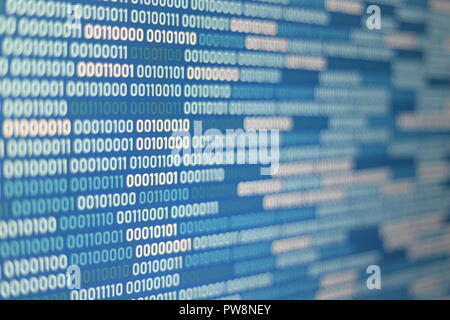 Big overload blockchain data. Blue binary data code background for internet and cyberspace security function. one and zero text on LED moniter screen. Stock Photo