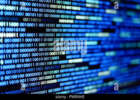 Big overload blockchain data. Blue binary data code background for internet and cyberspace security function. one and zero text on LED moniter screen. Stock Photo