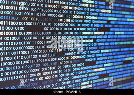 Big overload blockchain data. Blue binary data code background for internet and cyberspace security function. one and zero text on LED moniter screen. Stock Photo