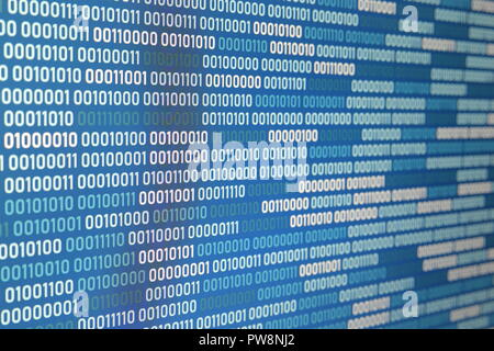 Big overload blockchain data. Blue binary data code background for internet and cyberspace security function. one and zero text on LED moniter screen. Stock Photo