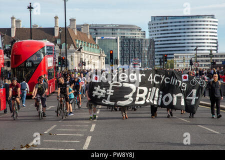 London, England, UK - October 13, 2018: Cyclists take part in the 'Pedal On Parliament' event organised by Stop Killing Cyclists, including a 'National Funeral' and 'Die In' to call for greater investment in safe cycling infrastructure. Credit: Joe Dunckley/Alamy Live News