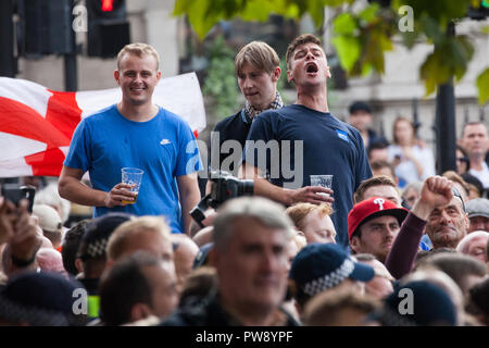 London, UK. 13th October, 2018. Supporters of the far-right Democratic Football Lads Alliance (DFLA) taunt anti-fascist groups including many women from the Feminist Anti-Fascist Assembly marching through London in protest against a demonstration by the DFLA. Anti-racist groups also held a Unity demonstration to coincide with the DFLA demonstration. Credit: Mark Kerrison/Alamy Live News Stock Photo