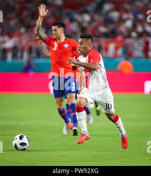 Miami Gardens, Florida, USA. 12th Oct, 2018. Peru midfielder CHRISTIAN CUEVA (10) chases a ball during an international friendly match between the Peru and Chile national soccer teams, at the Hard Rock Stadium in Miami Gardens, Florida. Credit: Mario Houben/ZUMA Wire/Alamy Live News Stock Photo