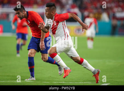 Miami Gardens, Florida, USA. 12th Oct, 2018. Peru midfielder CHRISTIAN CUEVA (10) runs for a ball during an international friendly match between the Peru and Chile national soccer teams, at the Hard Rock Stadium in Miami Gardens, Florida. Credit: Mario Houben/ZUMA Wire/Alamy Live News Stock Photo