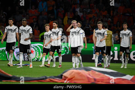 Amsterdam, Netherlands. 21st Apr, 2017. Soccer: Nations League A, Group stage, Group 1, Matchday 3: Netherlands - Germany in the Johan Cruyff Arena. The players from Germany leave the pitch disappointed after their 3-0 defeat. Credit: Ina Fassbender/dpa/Alamy Live News Stock Photo