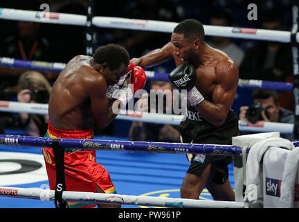 Metro Radio Arena, Newcastle, UK. Saturday 13th October 2018. Lawrence Osueke lands a right hand on Charles Adamu during the boxing fight at Metro Radio Arena, Newcastle, UK. Credit: UK Sports Agency/Alamy Live News Stock Photo