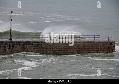 Porthleven cornwall ,storm and large waves hitting the clock tower Stock Photo