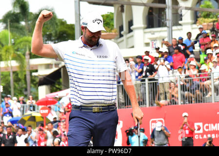 KUALA LUMPUR, MALAYSIA - October 14: Marc Leishman of Australia react after winning putt at the hole 18th during final round of CIMB CLASSIC 2018 at TPC Kuala Lumpur, KUALA LUMPUR, MALAYSIA on October 14, 2018. Credit: Ali Mufti/Alamy Live News Stock Photo