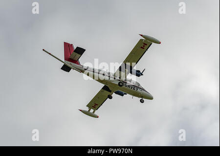 Ballydehob, West Cork, Ireland. 14th Oct, 2018. De Havilland DHC-6-300 Twin Otter survery aircraft registration C-GSGF makes a pass over Scrahanaleara for the fourth time this morning whilst performing a geoscience mapping programme.  The aircraft is owned by Sander Geophysics, which is based in Canada. Credit: Andy Gibson/Alamy Live News. Stock Photo