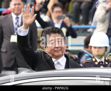 Asaka, Japan. 14th Oct, 2018. Japanese Prime Minister Shinzo Abe leaves the annual military review at the Ground Self Defence Force's Asaka training ground, suburban Tokyo on Sunday, October 14, 2018. 4,000 military personels, 260 military vehicles and 40 aircrafts participated the parade. Credit: Yoshio Tsunoda/AFLO/Alamy Live News Stock Photo