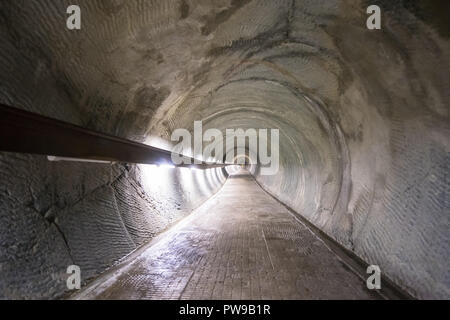 Long underground tunnel for pedestrians and cyclists Stock Photo