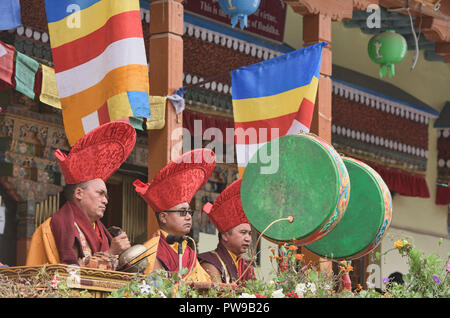 Red hat monks initiating a traditional Tibetan Buddhist Cham dance, Leh, Ladakh, India Stock Photo