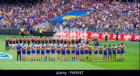 Melbourne Demons and West Coast Eagles Football Club standing pregame ceremony at Optus Stadium 2018 AFL Preliminary Final Perth Western Australia. Stock Photo