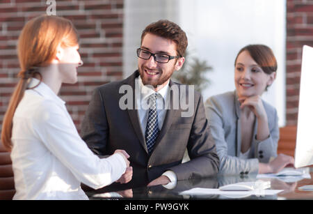 friendly handshake between colleagues in the office Stock Photo