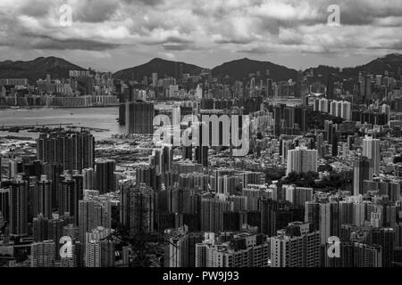Kowloon cityscape in BW, Hong Kong in background Stock Photo