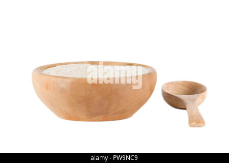 wooden bowl of porridge with spoon on isolated white background Stock Photo