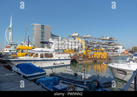 Liesure boats alongside The Camber area on Portsmouth Harbour, England, UK Spinnacker tower background. Stock Photo