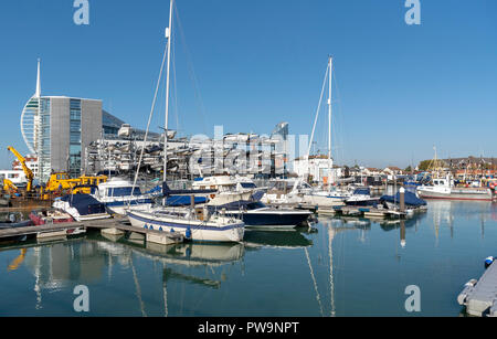 Liesure boats alongside The Camber area on Portsmouth Harbour, England, UK Spinnacker tower background. Stock Photo