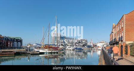 Liesure boats alongside The Camber area on Portsmouth Harbour, England, UK Spinnacker tower background. Stock Photo